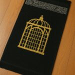 Black Islamic prayer mat made with soft velvet fabric for daily Salah