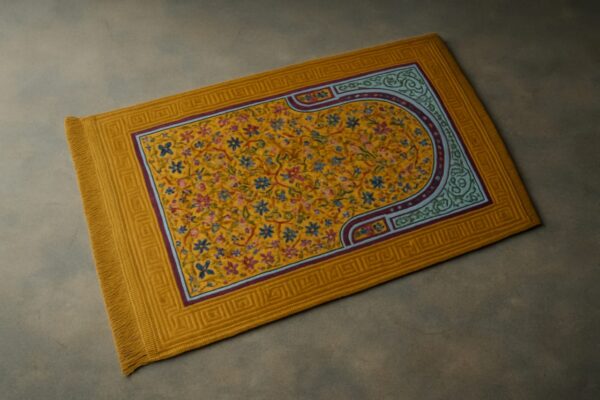 "Yellow prayer mat with intricate geometric patterns, neatly laid on the floor, symbolizing a serene space for worship."