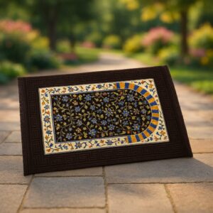 "Brown prayer mat with a soft, textured surface and subtle geometric pattern, laid flat on a clean floor."