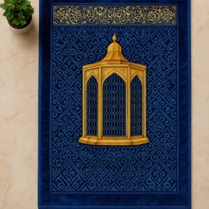 Luxurious royal blue Islamic prayer mat with a golden dome mihrab design and intricate geometric patterns, placed on a marble floor with a potted plant.